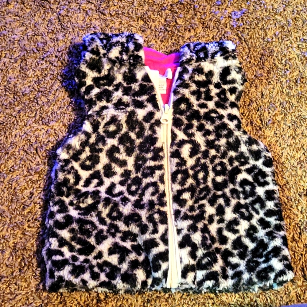 White and black with pink lining cheetah vest